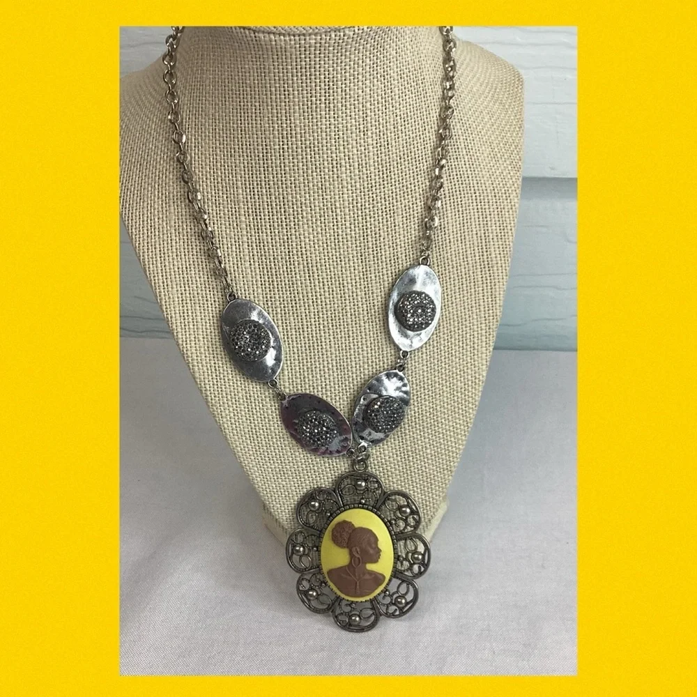 Yellow and silver cameo necklace.